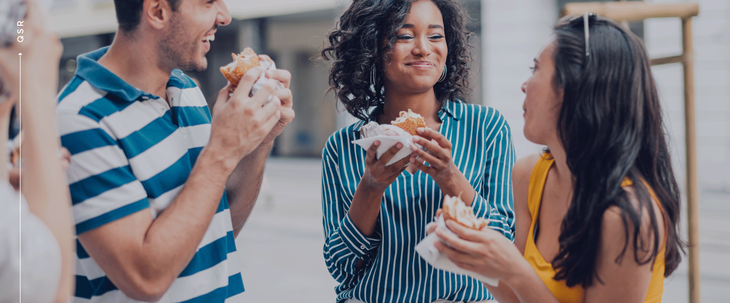 group of people eating sandwiches