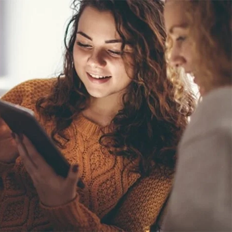 two people viewing tablet